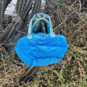 Monterrey bay aquarium bright blue, padded quilted mini bag